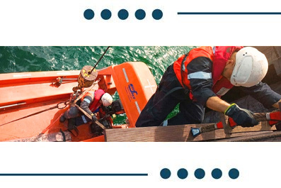 Rescue workers wearing helmets and life jackets on an orange boat performing a water rescue drill.