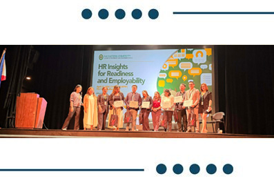 Group of people on a conference stage receiving awards, with a banner reading 'HR Insights for Readiness and Employability' in the background.