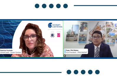 Two speakers in a split-screen video conference with names and titles displayed: Patricia Furtado, Global Lead - Ocean Centres, on the left, and Capt. Holaboc, Vice President - PHILCSMAT, on the right, against a banner with ocean-themed logos and photos in the background.